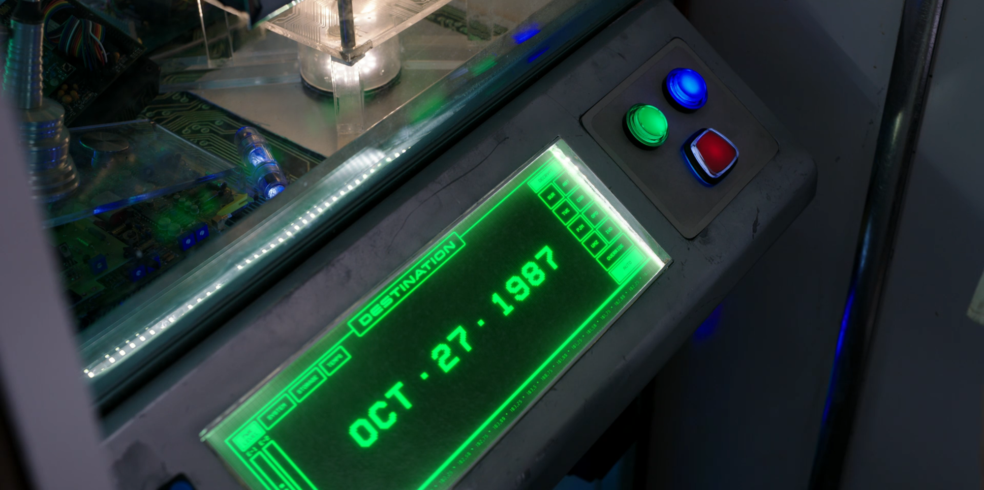 A still from Totally Killer (2023) showing a time machine's control panel. The date set is October 27, 1987.